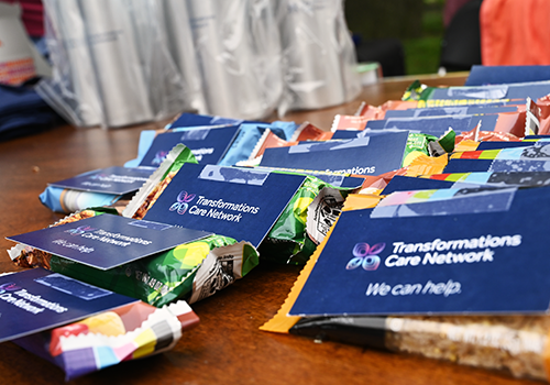 Close-up of Transformations Care Network packages.