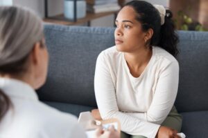 woman talking with therapist considers the signs of bipolar disorder in women