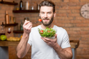 man eating a salad wonders if diet and depression are linked