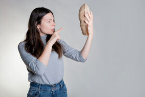 woman looking at bread wonders what is imposter syndrome