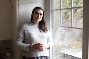 Person next to window feeling the benefits of esketamine use for depression