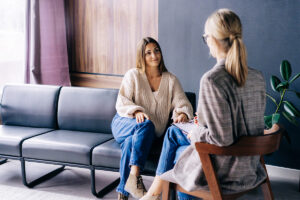 Two people talking about mental health stigma