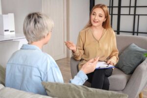 Two people at a mental health treatment session in Brighton