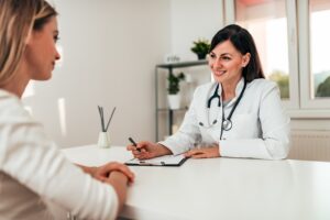 doctor and patient sit across a table and discuss spravato and how it can treat depression